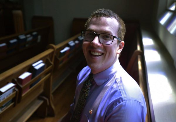 Chris Young sitting in a pew. Photo courtesy of the News & Advance.