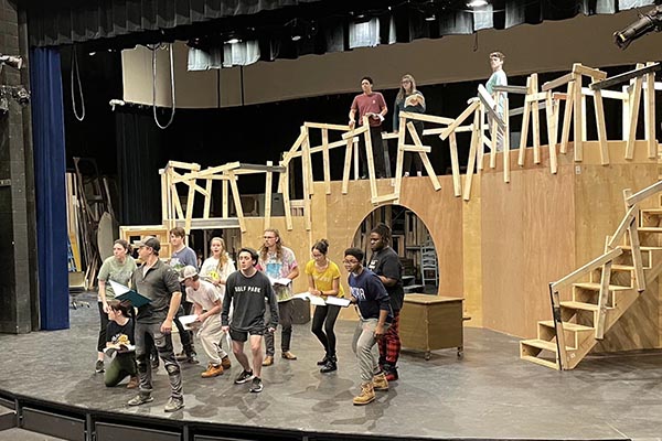The cast of "Urinetown: The Musical" rehearses.