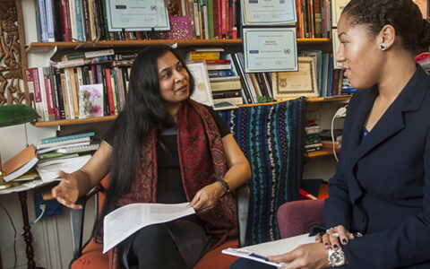 Dr. Sabita Manian working with a student in her office.