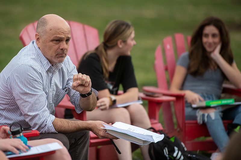 An instructor conducts an outdoor class.