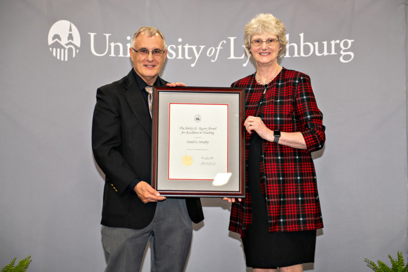 White man and white woman with certificate