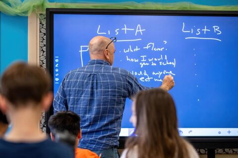 Dr. Chidsey Dickson writes on the board.