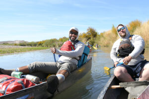 Two students canoeing.