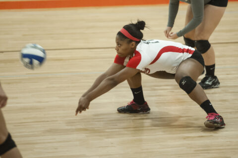 a volleyball player returning the ball.