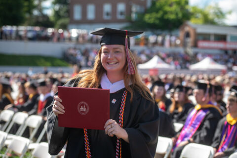 Girl at commencement smiling.