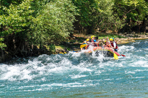 A raft going down a rapid.