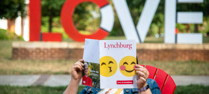 Magazine in front of the LOVE sign