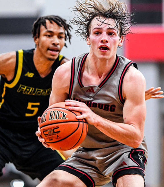 Basketball player playing defense.