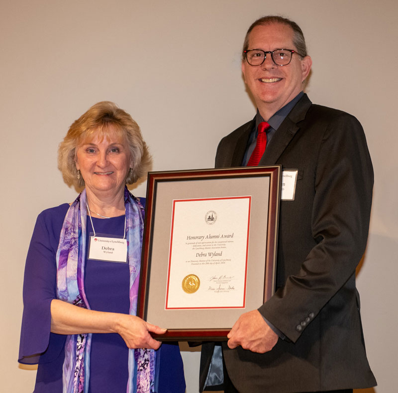 Debra C. Wyland ’24 HAA (left) poses for a photo with Dr. Stephan Elam ’16 EdD, an alumni board member.