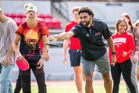 Young man throwing a frisbee