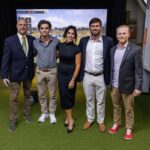 Group at dedication of golf simulator.