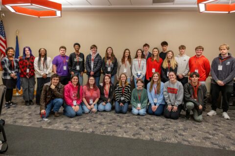 A group of 25 high school juniors and seniors pose for a picture.
