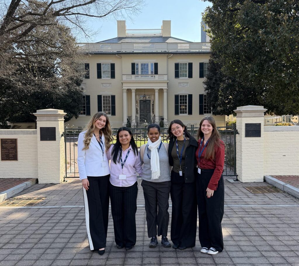 Pictured in front of the Executive Mansion in Richmond (left to right) are Susanna Shedd ’27, Jenny Moran Serrano ’27, Feker Fetene of Emory & Henry University, Camila Condado ’28, and Ashby Watts ’28.