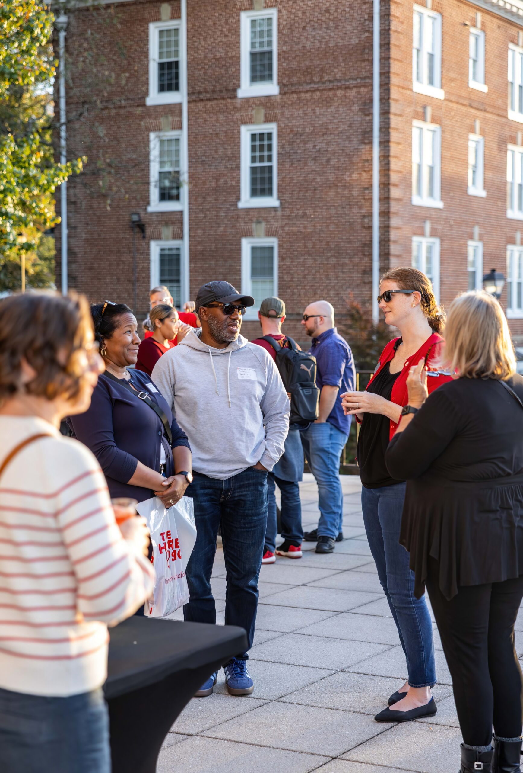 Networking on Hall Campus Center balcony