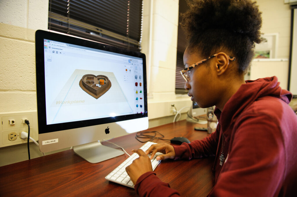 A Digital Fabrication Minor student working on a 3D model.