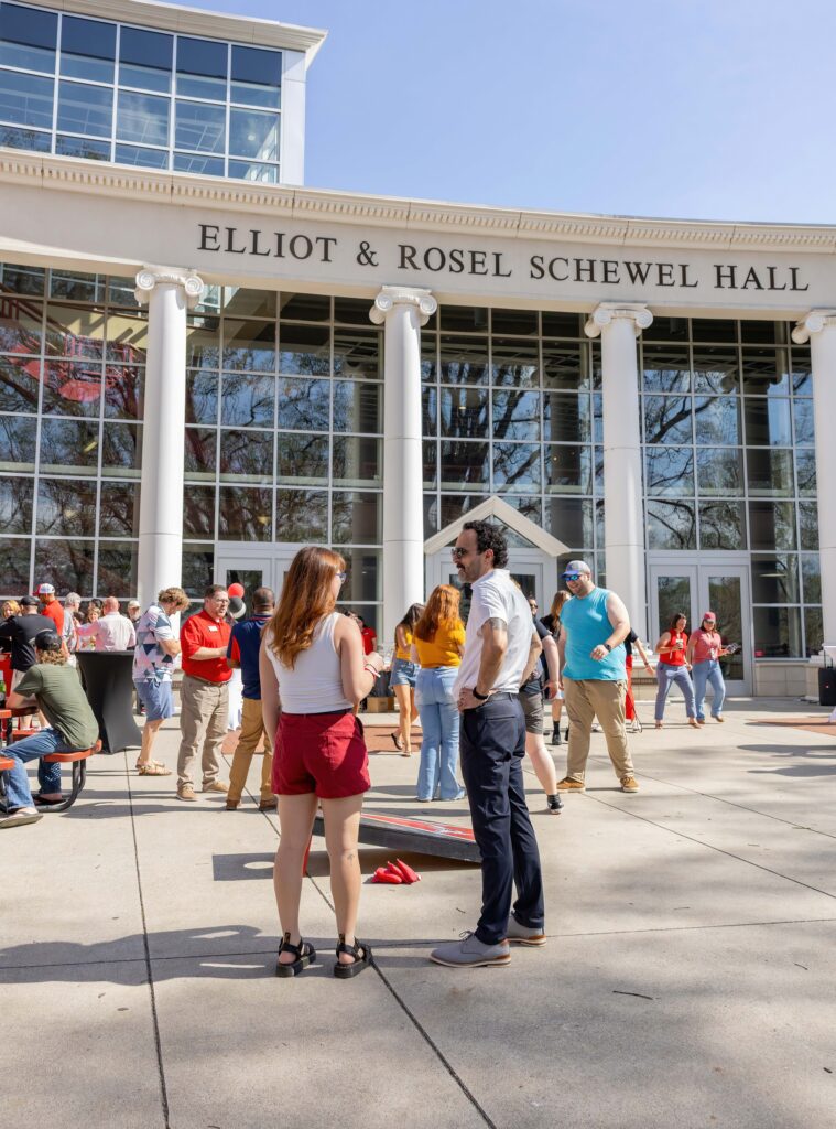 fridays on the dell; crowd of people mingling outside of Schewel Hall