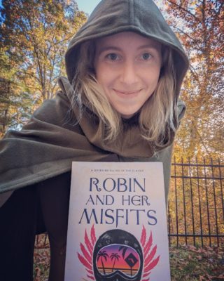 Dr. Kelly Ann Jacobson with book, "Robin and Her Misfits."