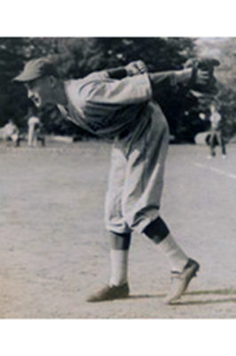Lloyd Flint winds up to pitch a baseball in 1950