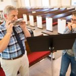Dr. George Miklas and Sam Lipert '23 play harmonica together