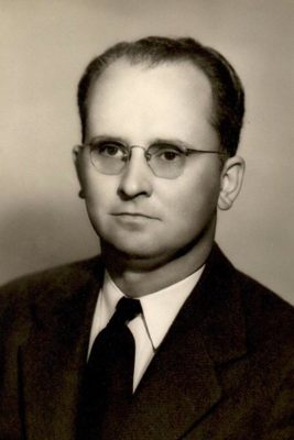 black and white portrait of a man with glasses