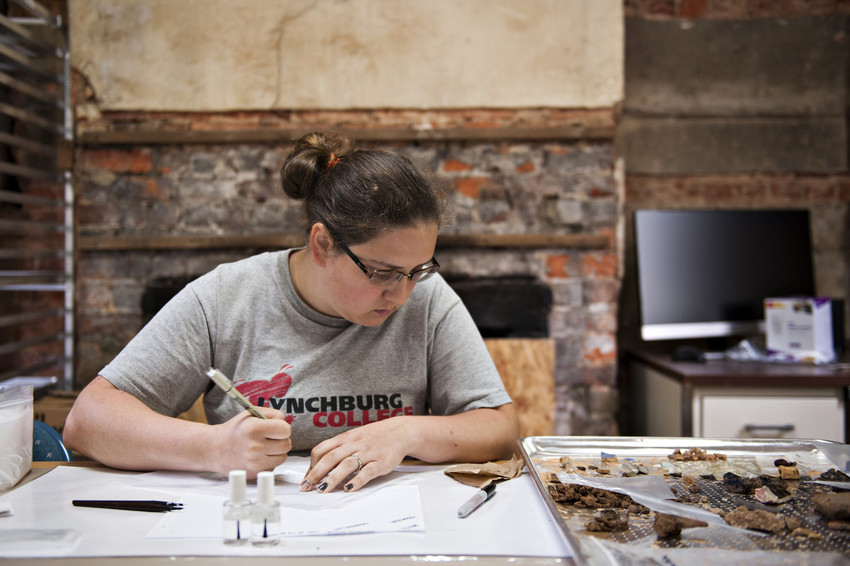 Diana Spangler ’14, now a history graduate student at LC, sorts artifacts and records information about them in the archaeology lab at Historic Sandusky.