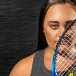 Christina Harris holding a tennis racket