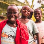 Three African kids smiling