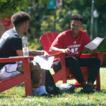 Two male students on Dell studying