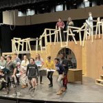 The cast of "Urinetown: The Musical" rehearses.