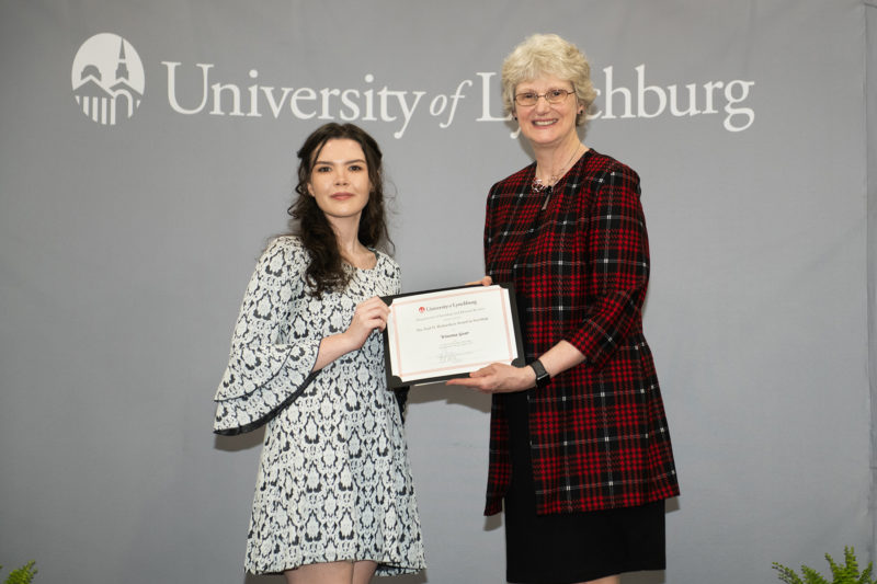 Winona Gear '23 accepts an award from Dr. Alison Morrison-Shetlar.