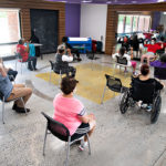 Students lead an exercise class for older adults