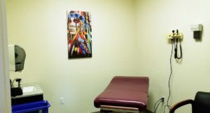 Exam room with table and painting