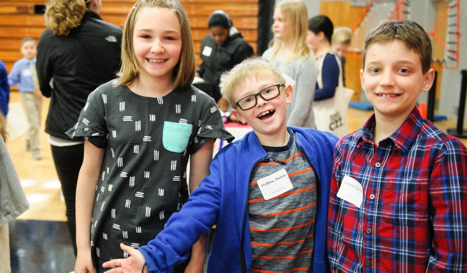 Students smile at the camera during Market Day