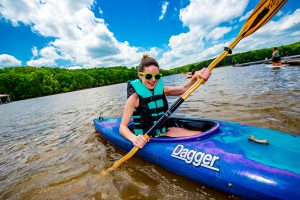 Female student kayaking the James River.