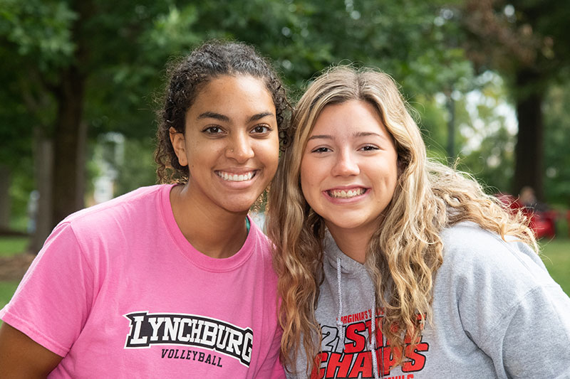 Two smiling University of Lynchburg students that are outdoors