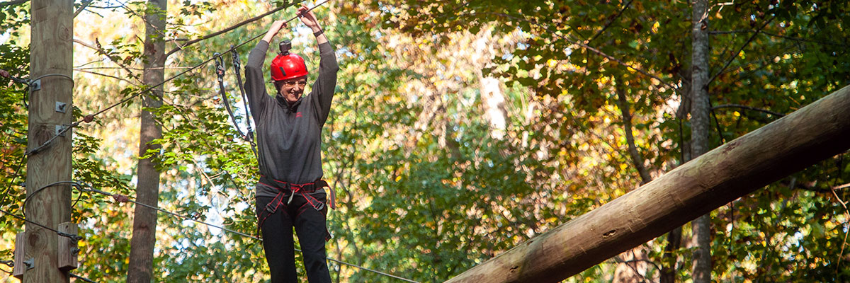 President Alison Morrison-Shetlar tackles the University's high ropes course as part of a GiveDay challenge.