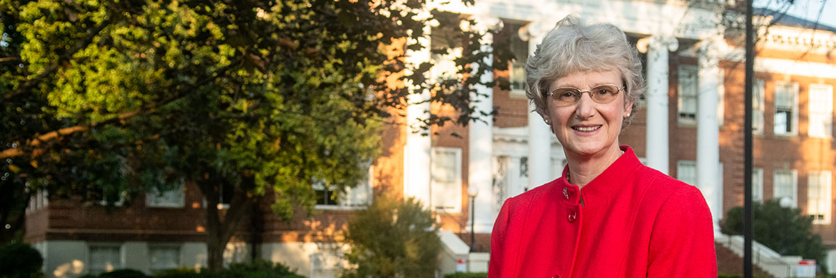 President Alison Morrison-Shetlar in front of Hopwood Hall