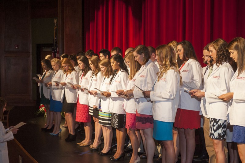 University of Lynchburg physician assistant students recite the PA Professional Oath after receiving their white coats.
