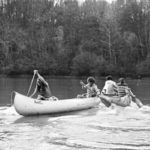People canoeing on college lake